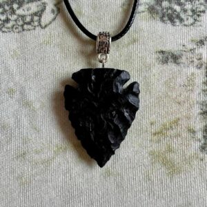 Shadow piercer, black arrowhead pendant carved from African Blackwood