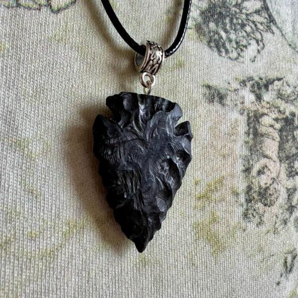 Shadow piercer, black arrowhead pendant carved from African Blackwood