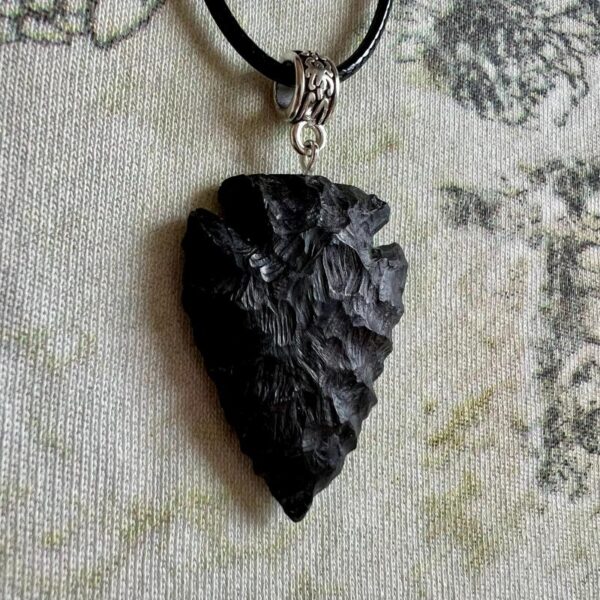 Shadow piercer, black arrowhead pendant carved from African Blackwood