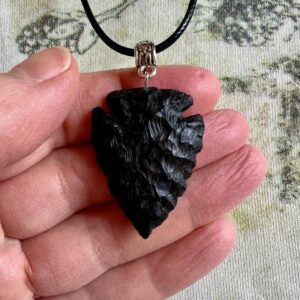 Shadow piercer, black arrowhead pendant carved from African Blackwood