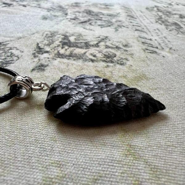 Shadow piercer, black arrowhead pendant carved from African Blackwood