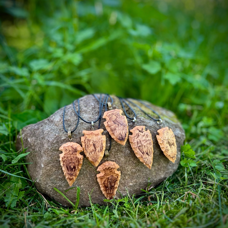 wood-carved arrowheads with pyrography