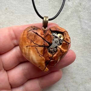 steampunk heart pendant with metal cogs and gears