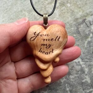 wooden heart pendant that looks like it's melting