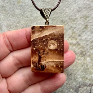 Rectangular wooden pendant featuring a Fox Spirit gazing up at the Northern Lights