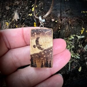 Aurora pendant with a flying bird in a starry sky